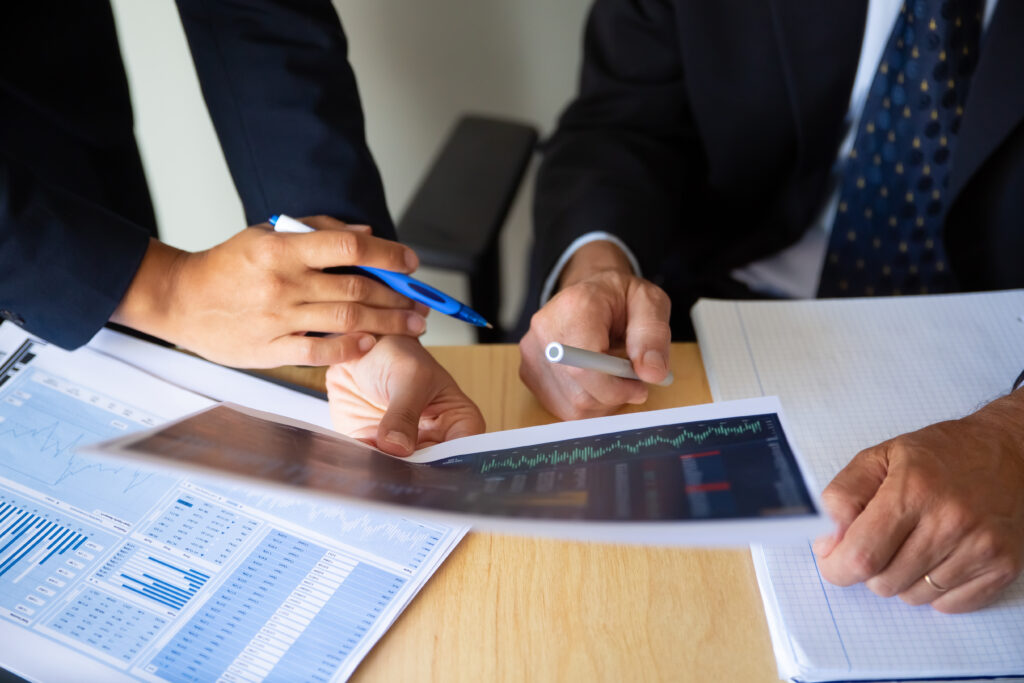 investor and broker discussing trading strategy